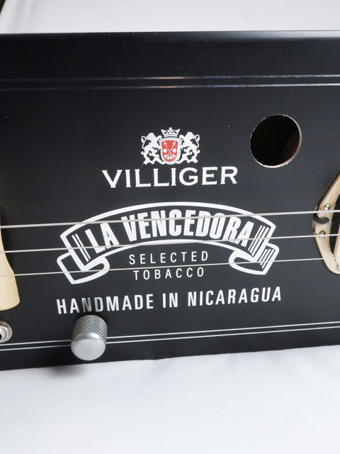 Close up view of a villiger 3 string cigar box guitar handmade by Mike Snowden.