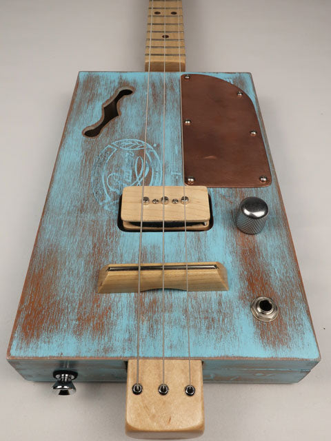 Cigar box guitar blue with p90 pickup made by mike snowden front view.