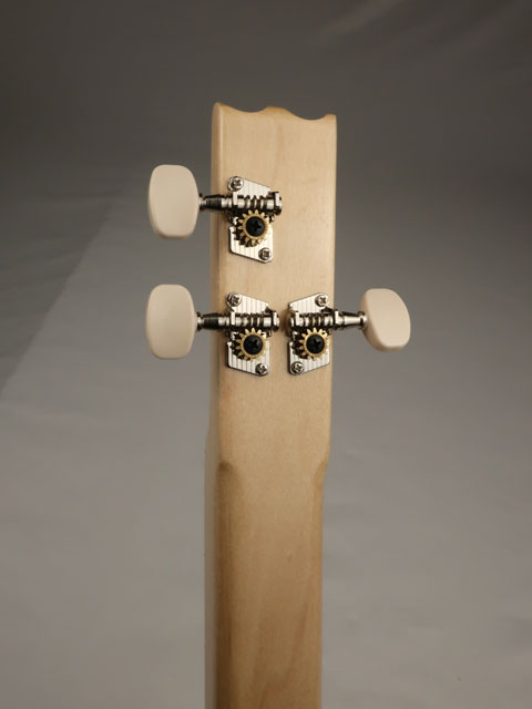 Back close-up of a cigar box guitar neck  and headstock with 'Snowden' branding on a gray background.