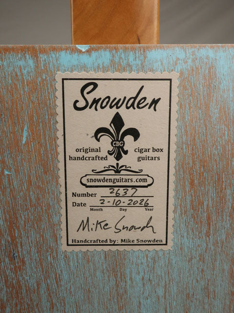 Back view Snowden Guitars logo on a blue cigar box guitar made by Mike Snowden.