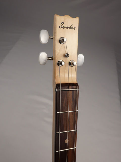 Headstock of cigar box guitar 3 string  instrument with snowden logo.  Handmade by Mike Snowden.