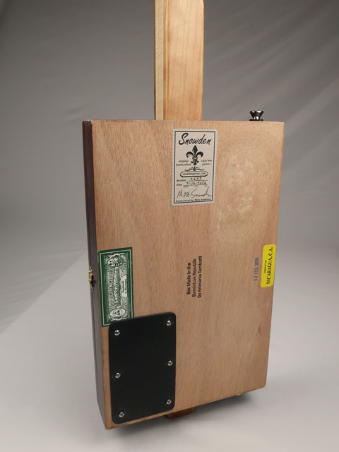 Back view cigar box guitar with Snowden guitar logo sticker. Handmade by Mike Snowden.