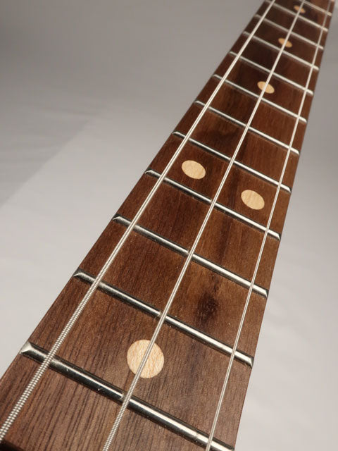 Front view cigar box guitar 3 string neck. Walnut with maple inlay handmade by Mike Snowden.