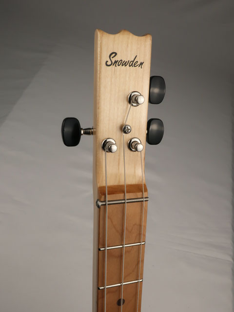 Cigar Box Guitar headstock with 'Snowden' branding on a gray background. Made by Mike Snowden with a Padron cigar box.