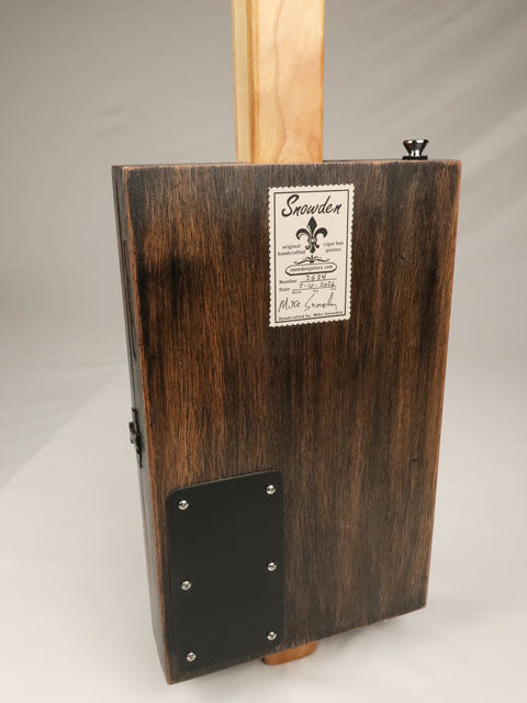 Back view of a cigar box guitar with Snowden guitars logo on the back. Made by Mike Snowden with a Padron cigar box.