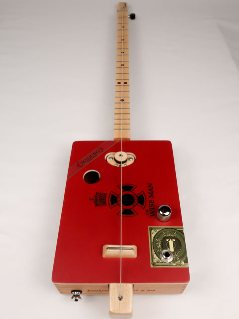 Front view of a one String cigar box guitar diddly bow cbg handmade by Mike Snowden of Snowden Guitars. This cigar box guitar is made with a wise man cigar box.