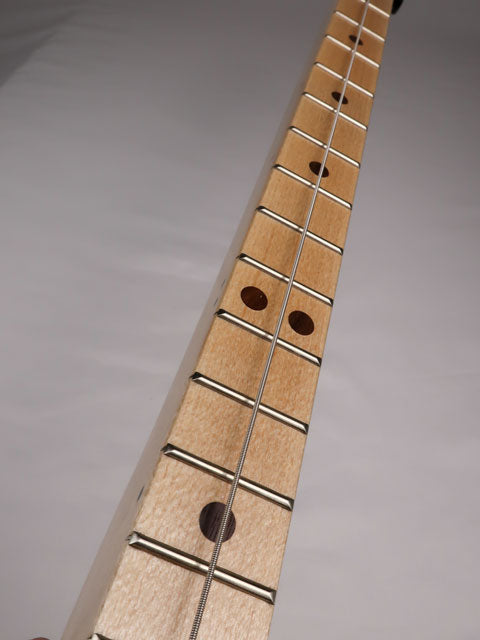 Front view of a one string cigar box guitar diddly bow. Made with a maple neck and walnut inlay by Mike Snowden of Snowden Guitars.