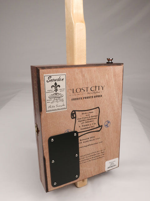 Back view of a one String diddly bow cigar box guitar CBG handmade by Mike Snowden of Snowden Guitars. This cigar box guitar is handmade with a Lost City cigar box.