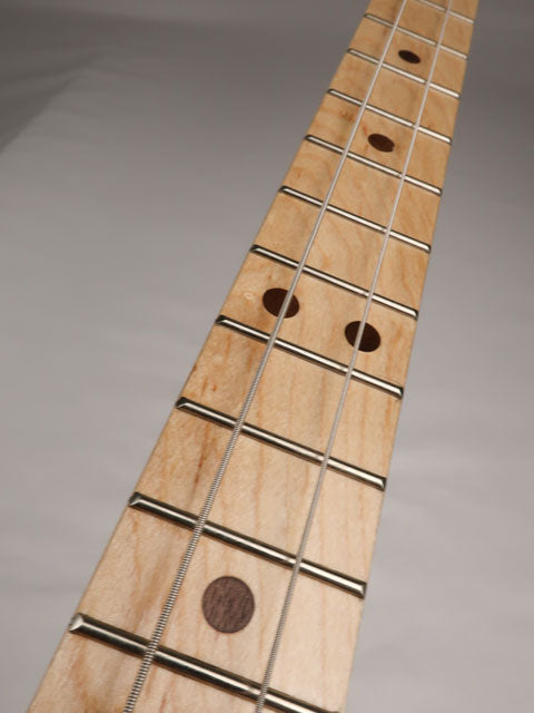 Front view of a cigar box guitar neck made with a maple fretboard and walnut inlay. Handmade by Mike Snowden of Snowden Guitars.