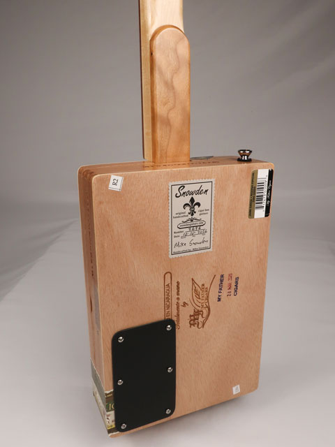 Back view of a cigar box guitar with a Jaime Garcia cigar box. This cigar box guitar is handmade by Mike Snowden of Snowden Guitars.
