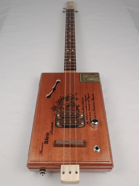 Front view of a 3 string cigar box guitar made with a A Fuente cigar box. This cigar box guitar is made by Mike Snowden of Snowden Guitars. 
