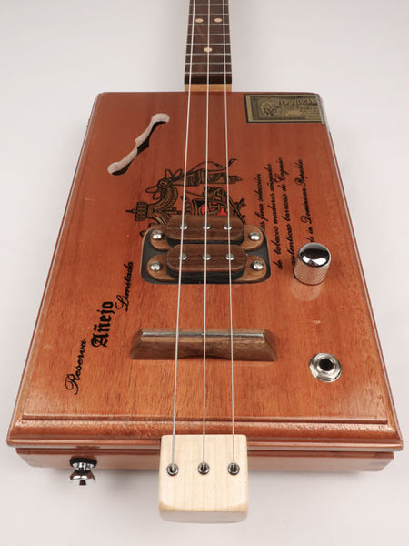 Front view of a 3 string cigar box guitar made with a A Fuente cigar box. This cigar box guitar is made by Mike Snowden of Snowden Guitars. 