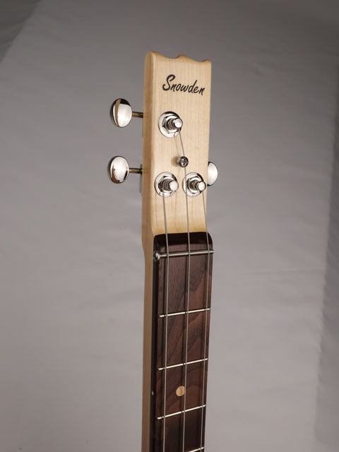 Front view of a cigar box guitar neck and headstock with Snowden Guitars logo on the front. 