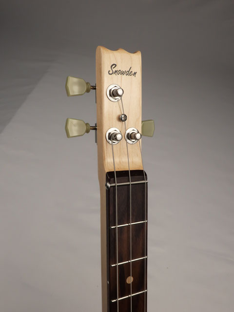 Cigar box guitar headstock with 'Snowden' branding on a gray background.